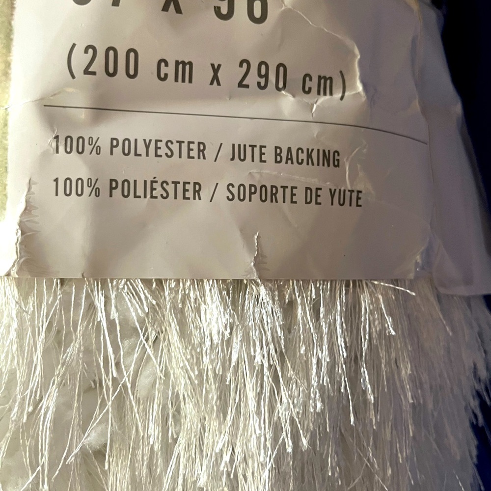Super Fringe Rug. White in color, brand new